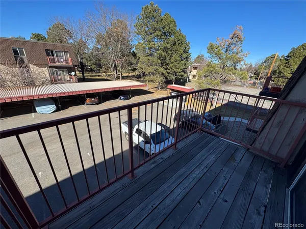 a view of balcony with furniture