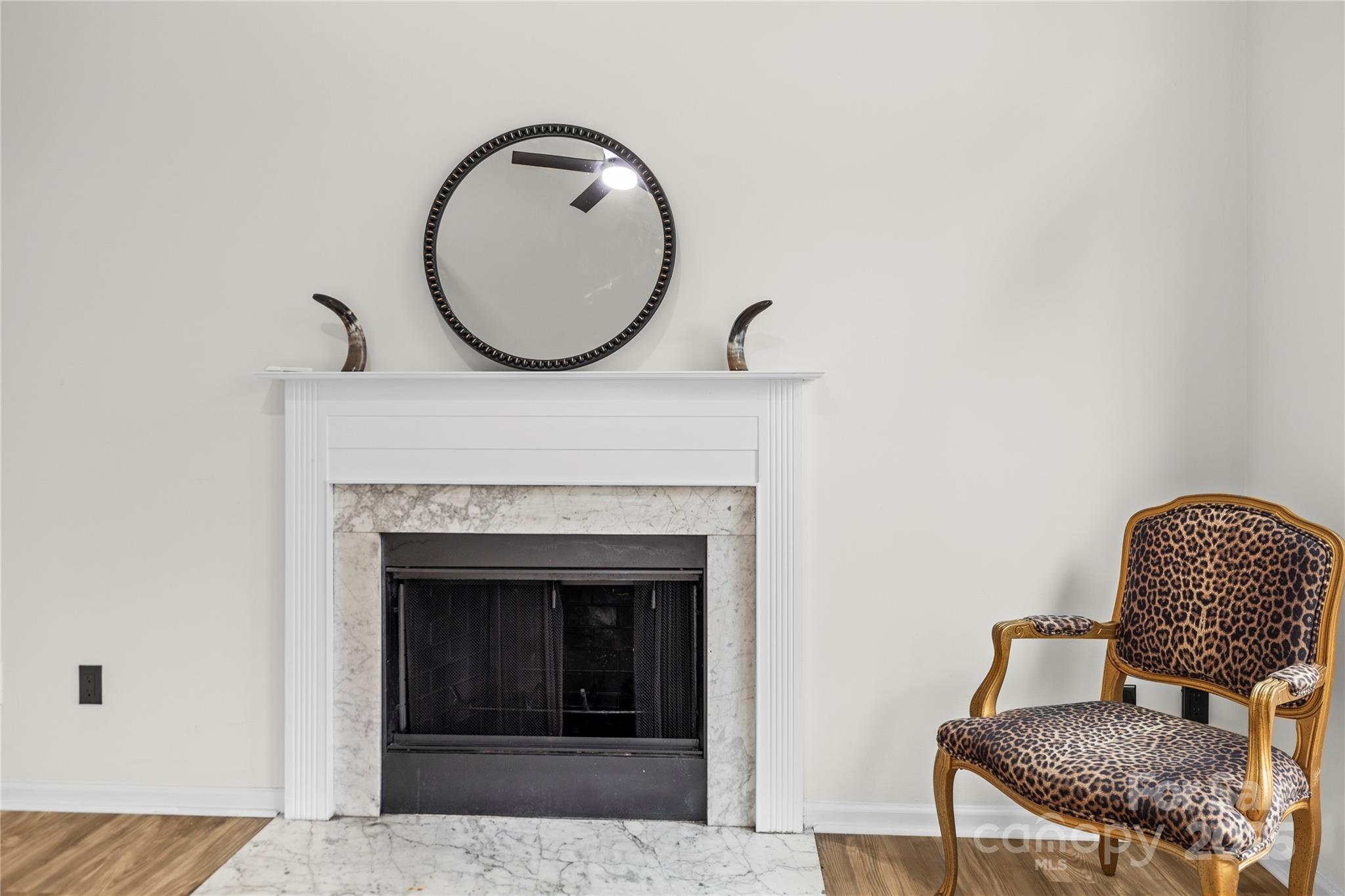 10211 Ridgewell Court Charlotte, NC 28215 - Photo 13 of 41 a living room with furniture and a fireplace
