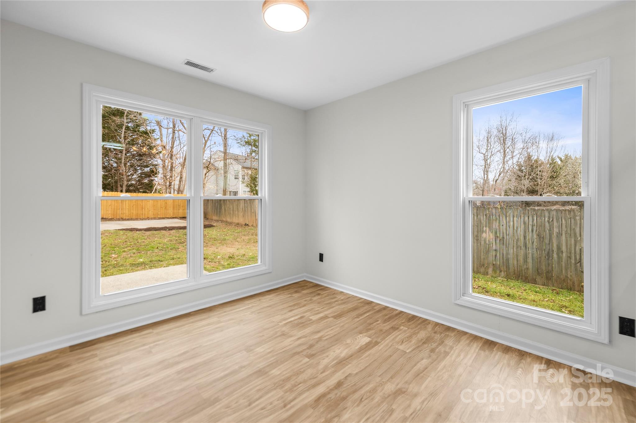 10211 Ridgewell Court Charlotte, NC 28215 - Photo 19 of 41 a view of an empty room with a window