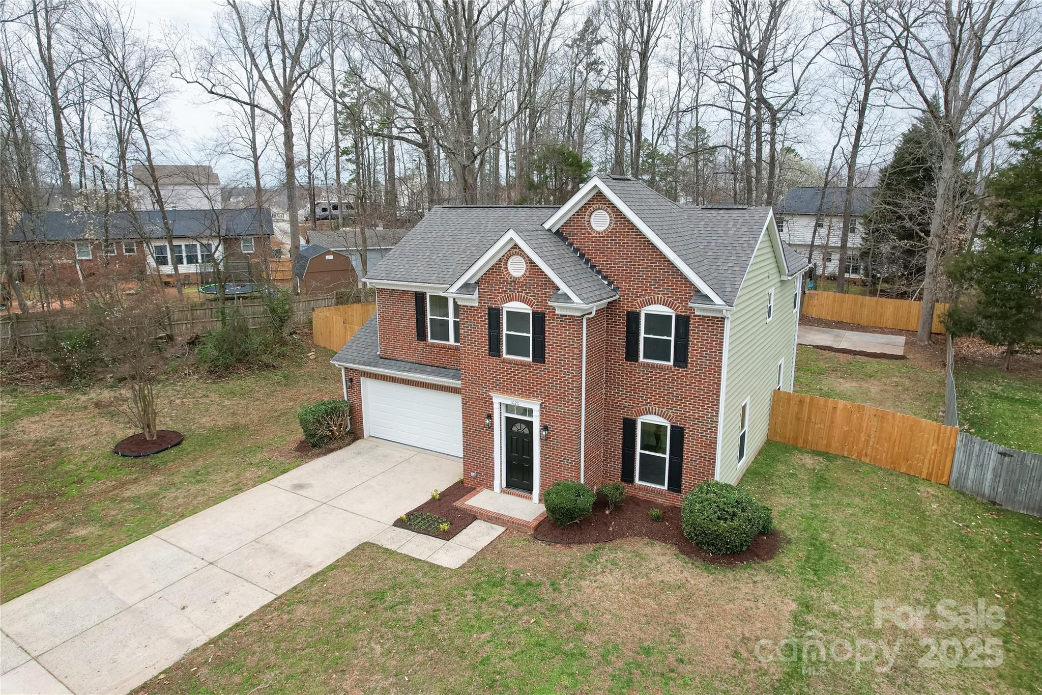 10211 Ridgewell Court Charlotte, NC 28215 - Photo 3 of 41 a front view of a house with garden