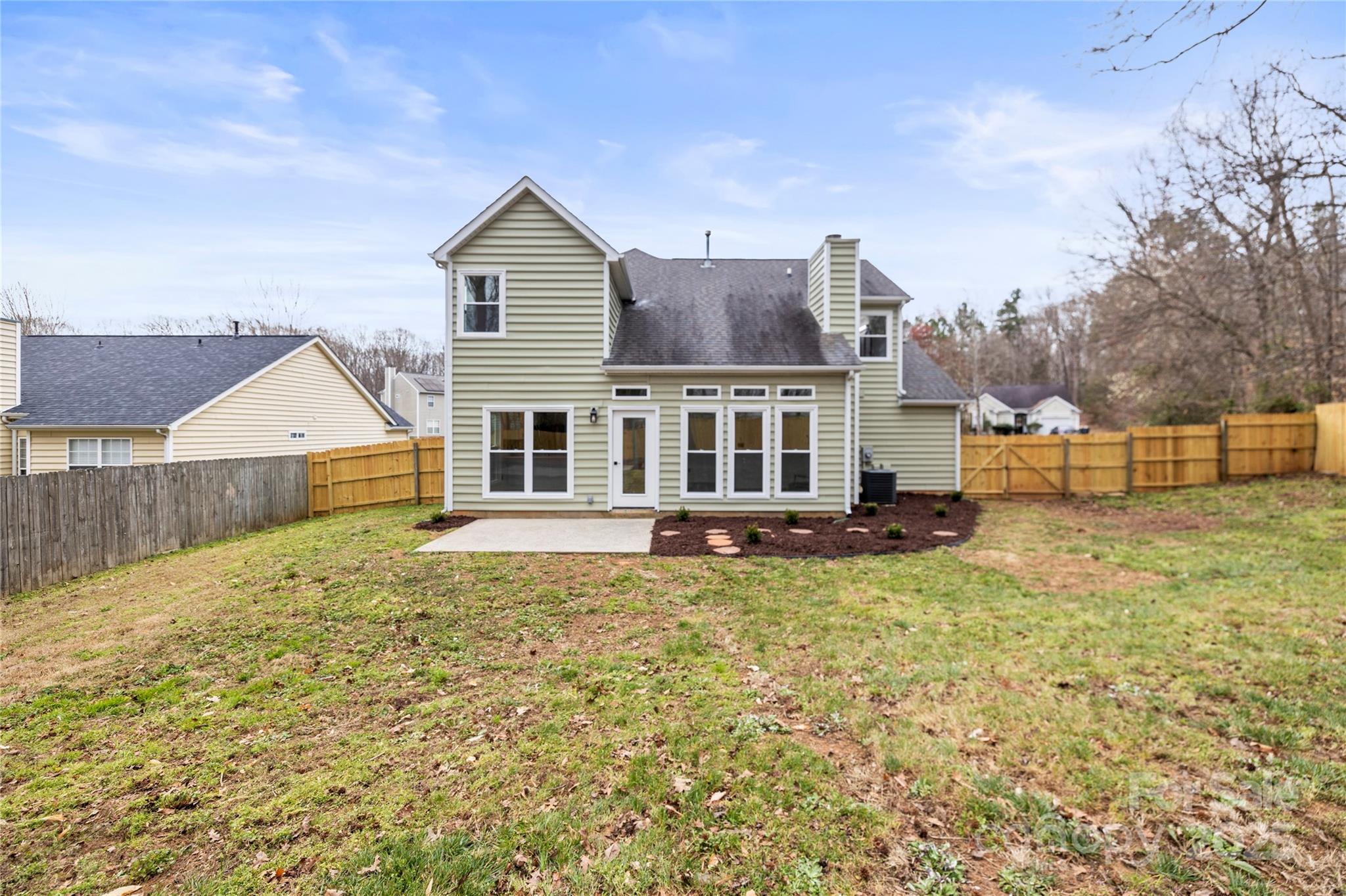 10211 Ridgewell Court Charlotte, NC 28215 - Photo 40 of 41 a view of a house with a yard