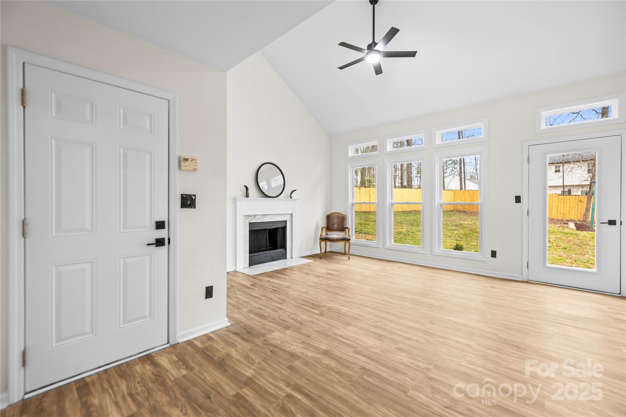 10211 Ridgewell Court Charlotte, NC 28215 - Photo 9 of 41 a view of an empty room with window and fireplace