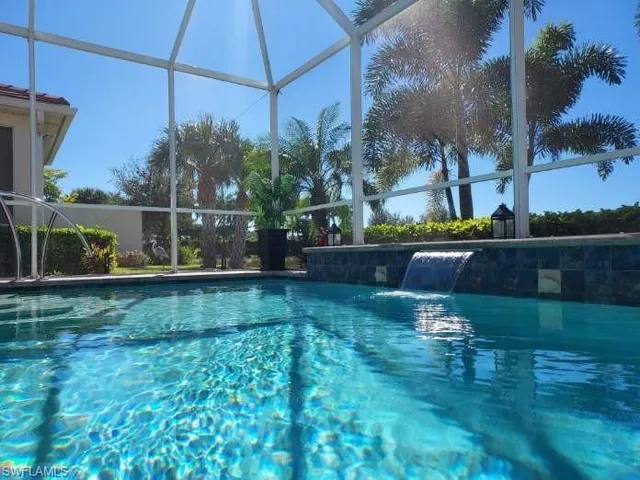 a view of backyard with seating area and green space