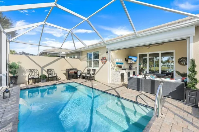 a living room with lots of furniture and a wooden floor