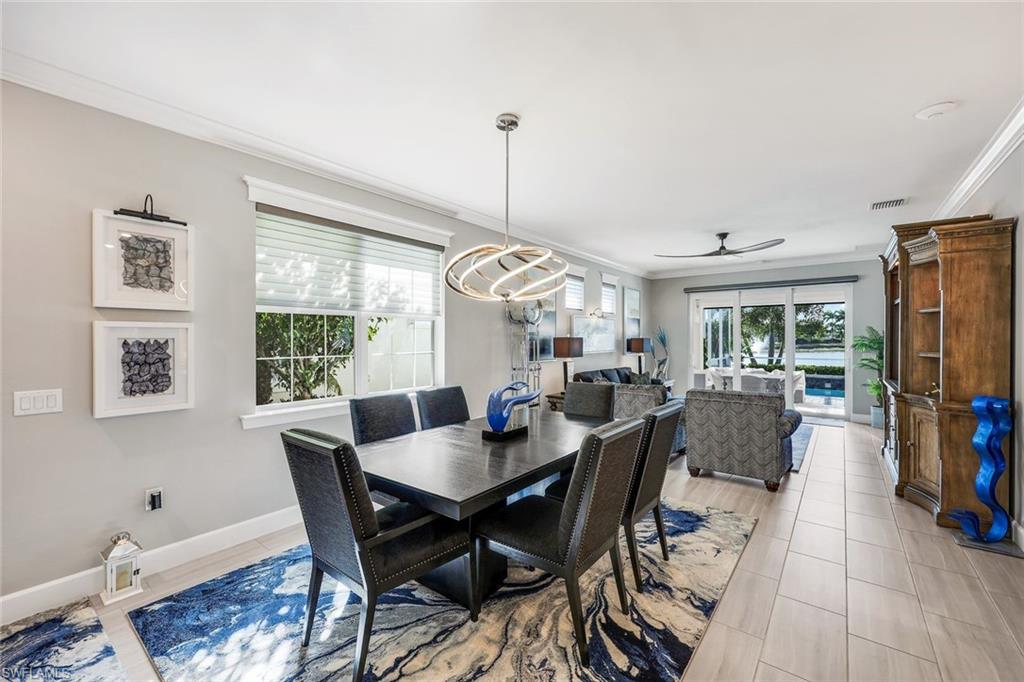 20022 Parrot Key Court Estero, FL 33928 - Photo 6 of 31 a view of a dining room with furniture window and outside view