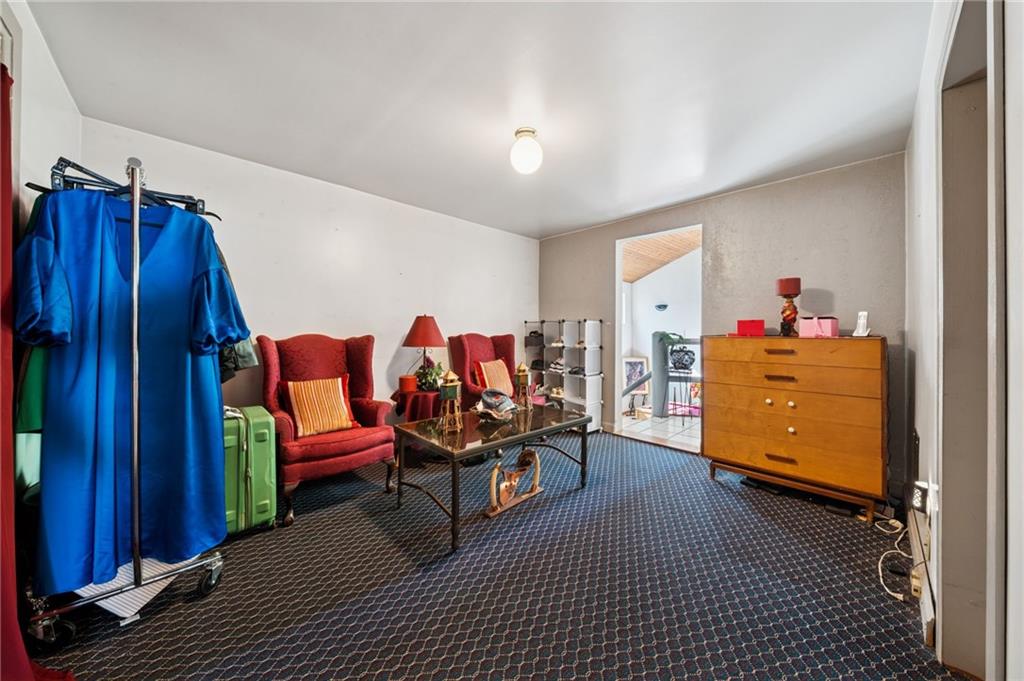 824 Magnus Lane Irwin, PA 15642 - Photo 13 of 40 a living room with furniture and a wooden floor