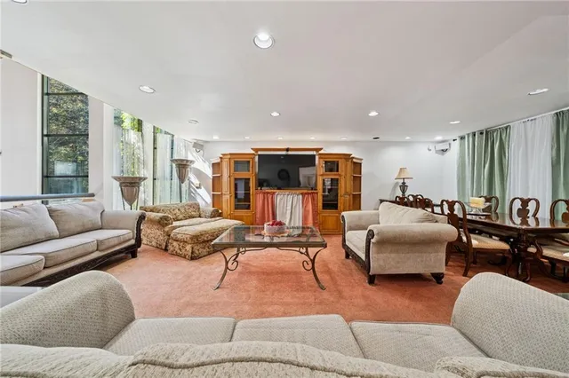 a living room with furniture window and lamp