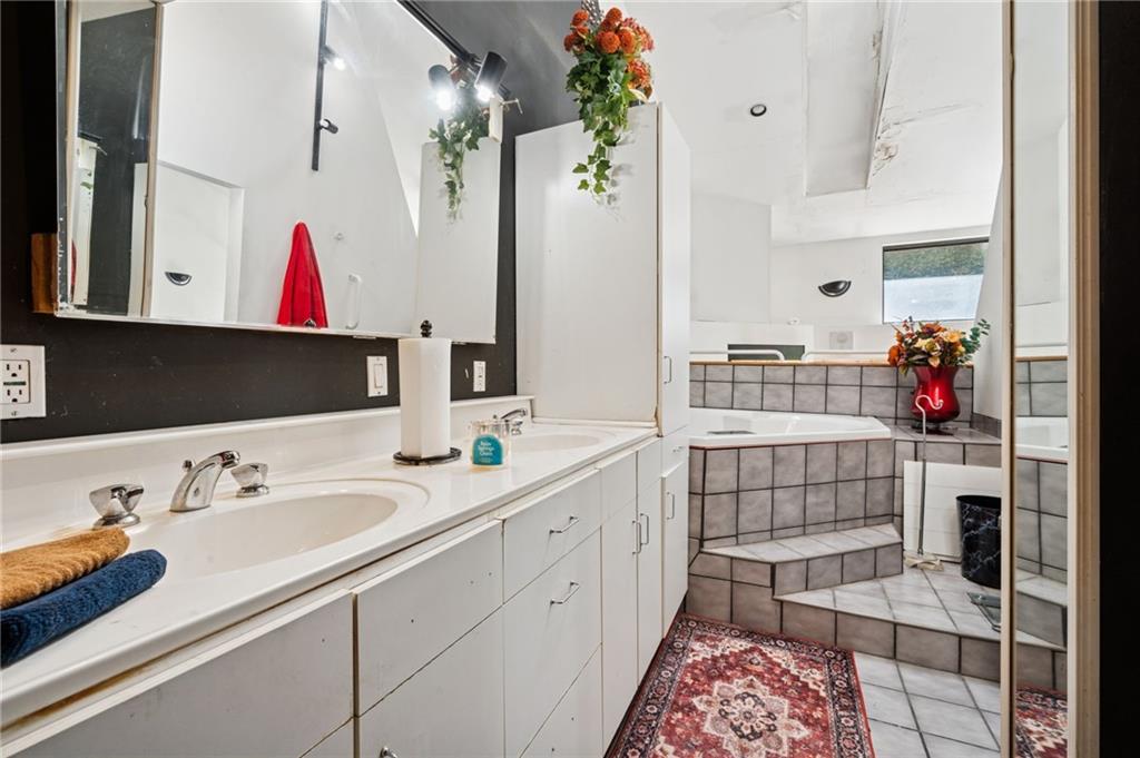 824 Magnus Lane Irwin, PA 15642 - Photo 21 of 40 a bathroom with a sink and a mirror