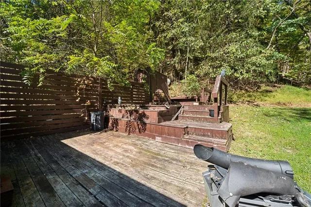 a view of a backyard with sitting area
