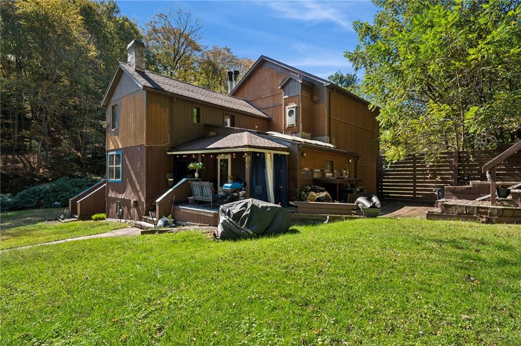 824 Magnus Lane Irwin, PA 15642 - Photo 31 of 40 a view of a house with backyard porch and sitting area
