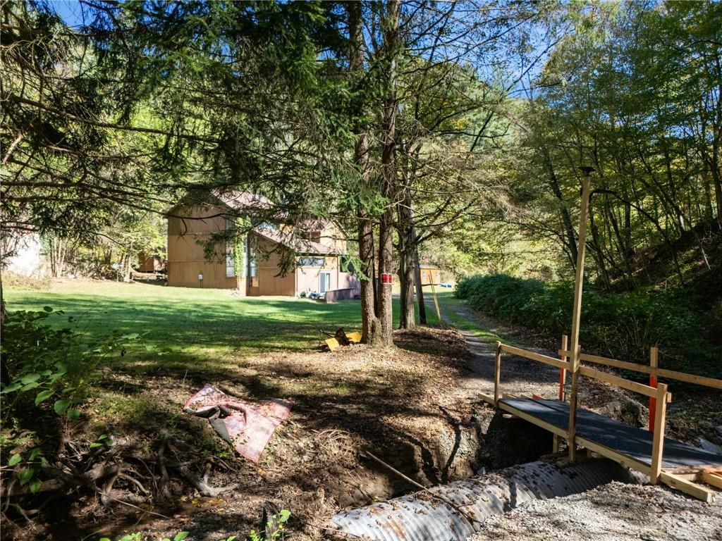 824 Magnus Lane Irwin, PA 15642 - Photo 33 of 40 a view of backyard with swimming pool and green space