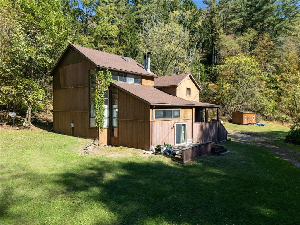 824 Magnus Lane Irwin, PA 15642 - Photo 35 of 40 a front view of a house with a garden and yard