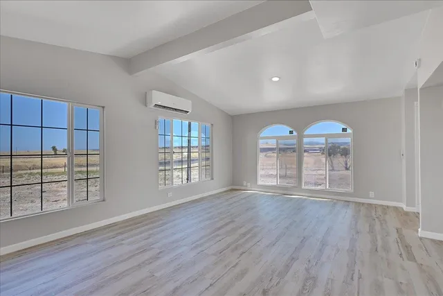 a kitchen with stainless steel appliances granite countertop a sink and a stove