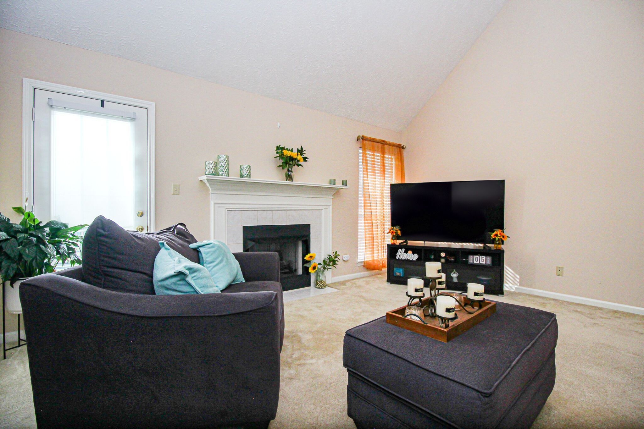 9 Battlefield Cove Jackson, TN 38305 - Photo 13 of 24 a living room with furniture a fireplace and a flat screen tv