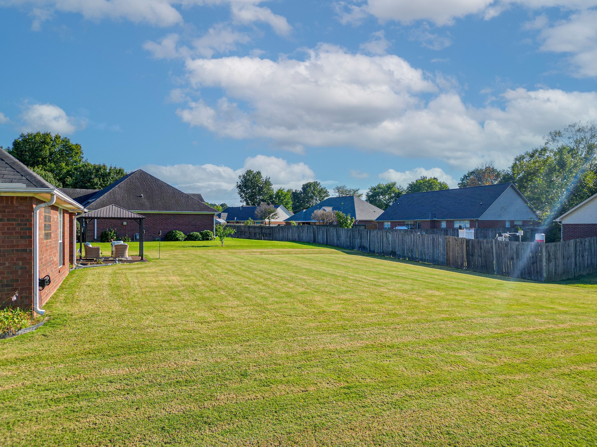 9 Battlefield Cove Jackson, TN 38305 - Photo 23 of 24 a view of swimming pool with lawn chairs and large tree