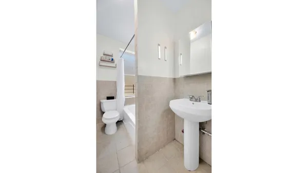 a kitchen with a sink and a refrigerator