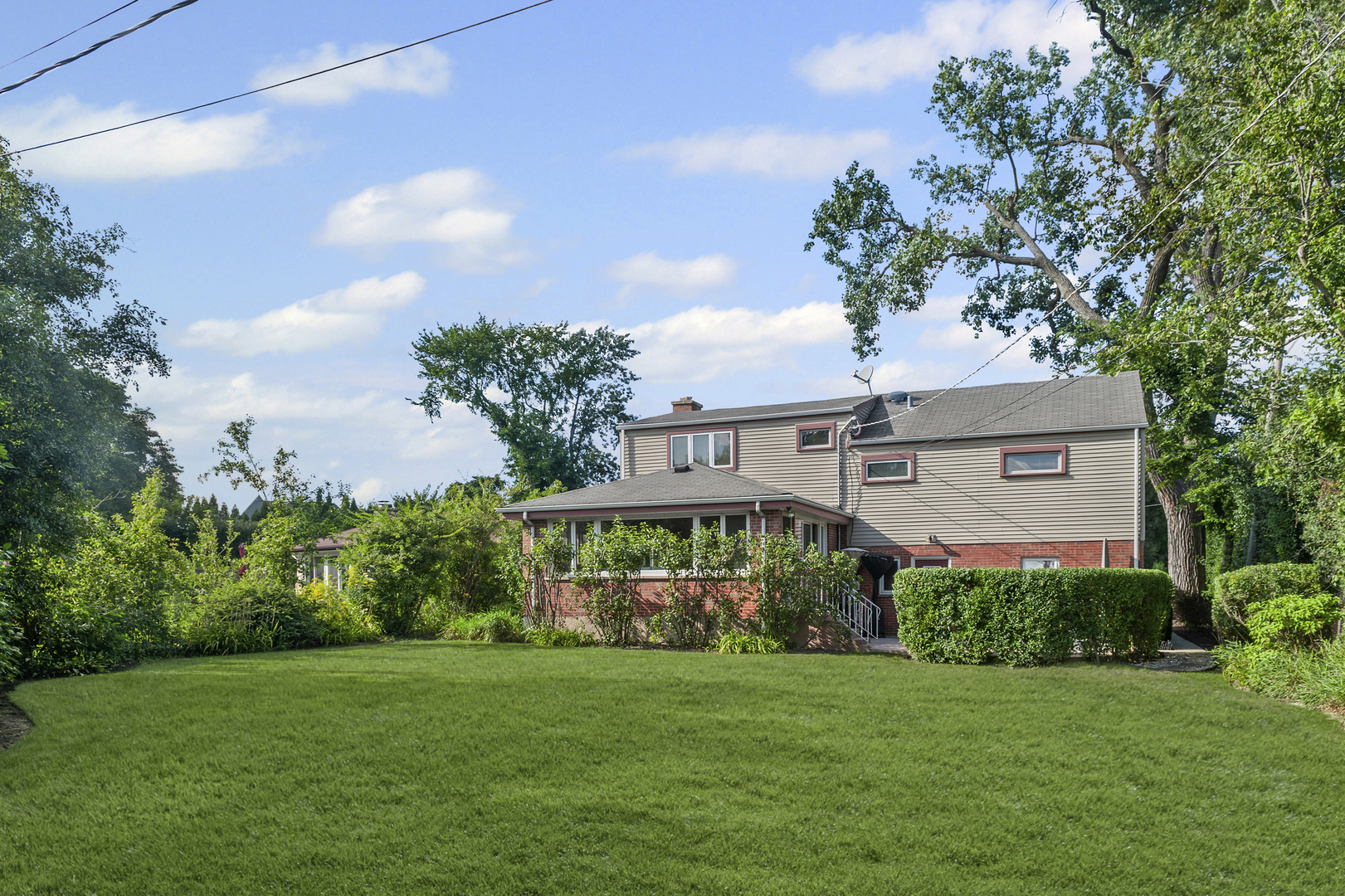 1128 Green Bay Road Glencoe, IL 60022 - Photo 21 of 28 a view of a house with a big yard plants and large trees