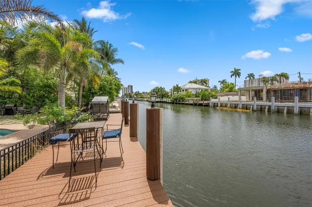 a view of a lake with outdoor seating space