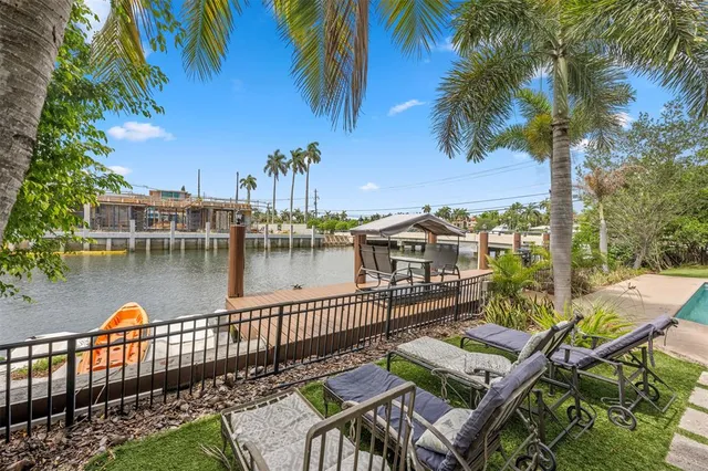 a view of a lake with furniture