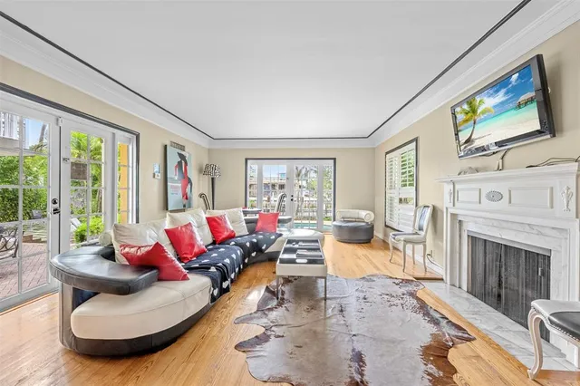 a living room with furniture large window and a flat screen tv