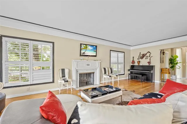 a living room with furniture flat screen tv and a fireplace