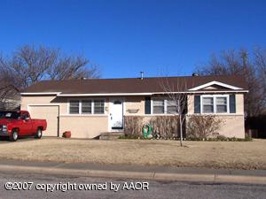 5143 South Bonham Street Amarillo, TX 79110 - Photo 1 of 1 a front view of a house with a yard
