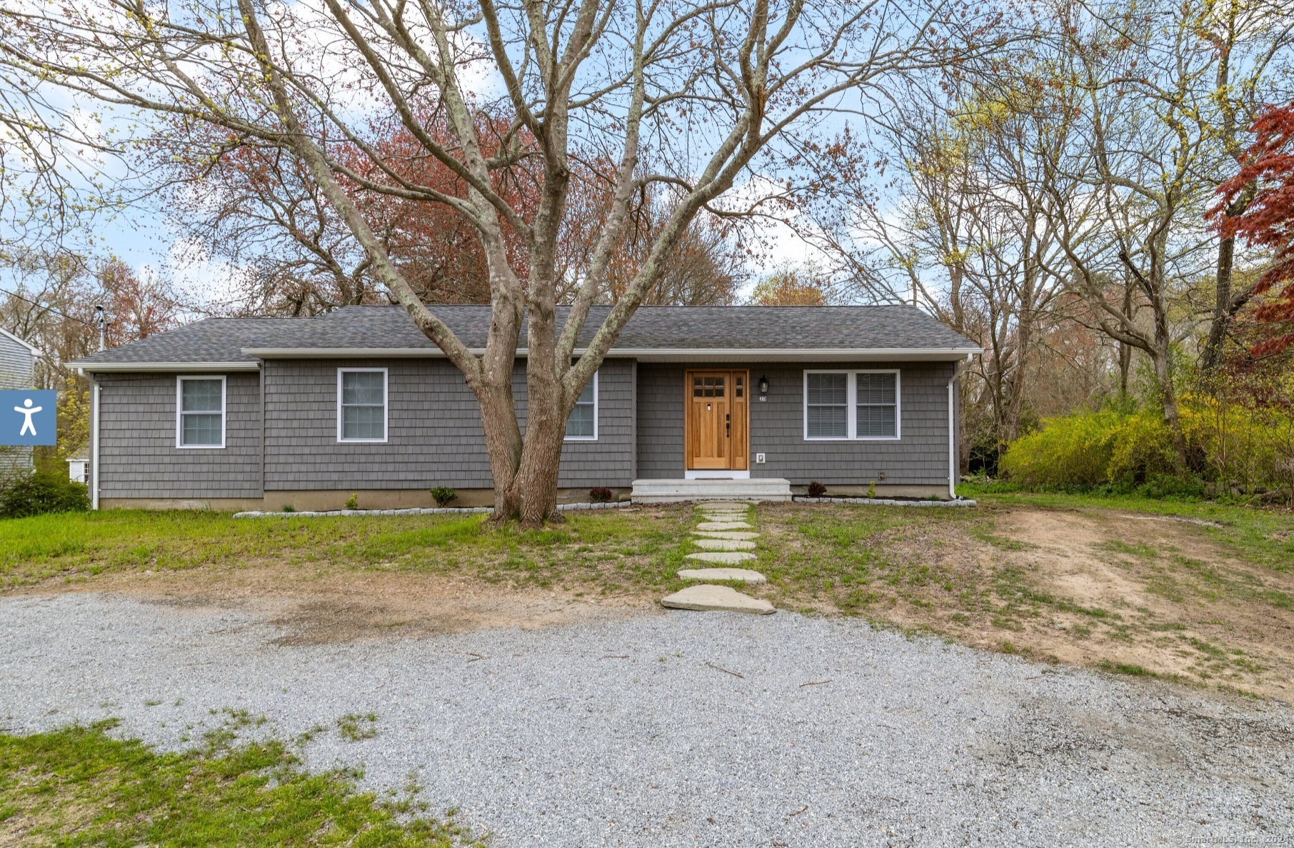 a front view of a house with a garden