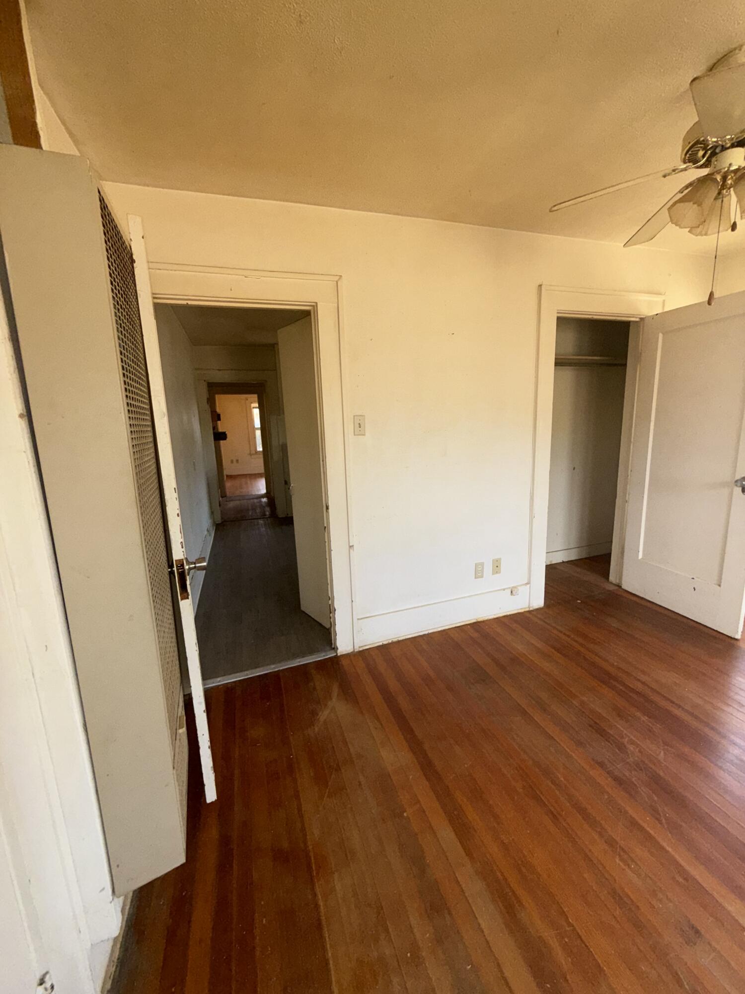 2320 21st Street Lubbock, TX 79411 - Photo 12 of 29 a view of a hallway view with wooden floor and staircase