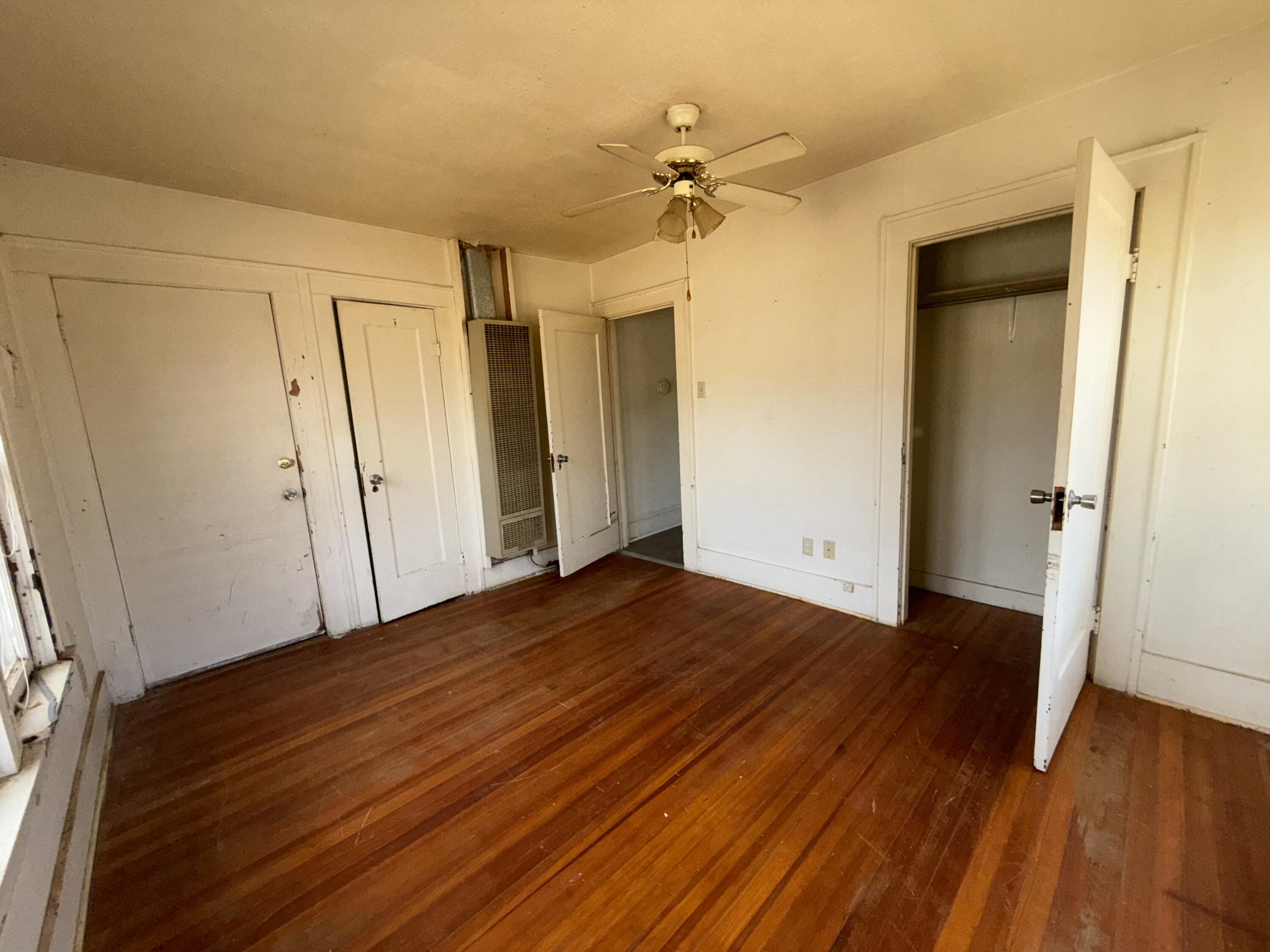 2320 21st Street Lubbock, TX 79411 - Photo 13 of 29 a view of empty room with wooden floor