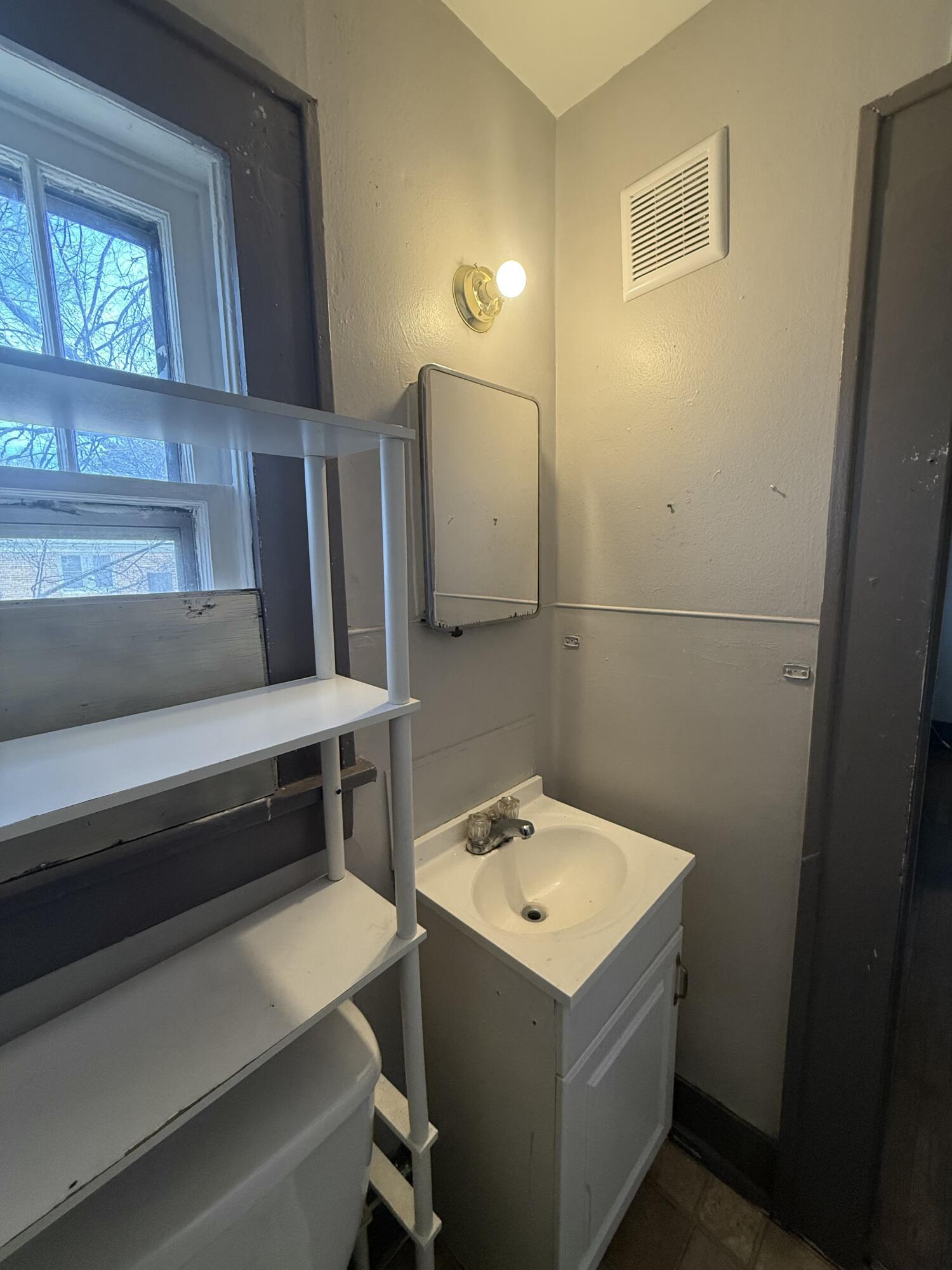2320 21st Street Lubbock, TX 79411 - Photo 28 of 29 a utility room with a sink