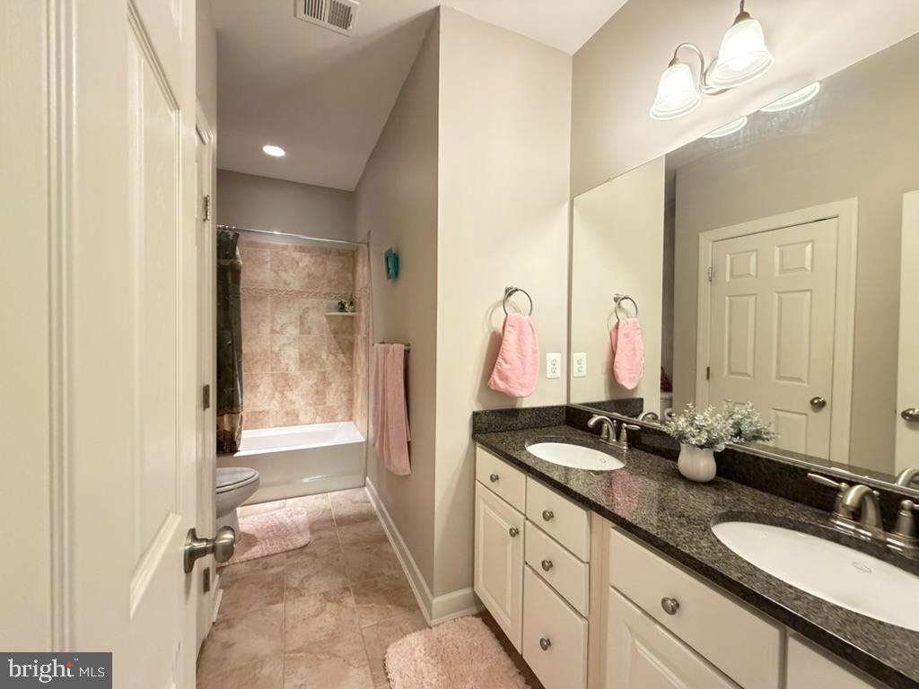 9804 Anvil Court Perry Hall, MD 21128 - Photo 18 of 21 a bathroom with double sink and a mirror