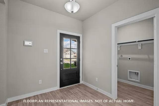 a view of a street with houses in the background