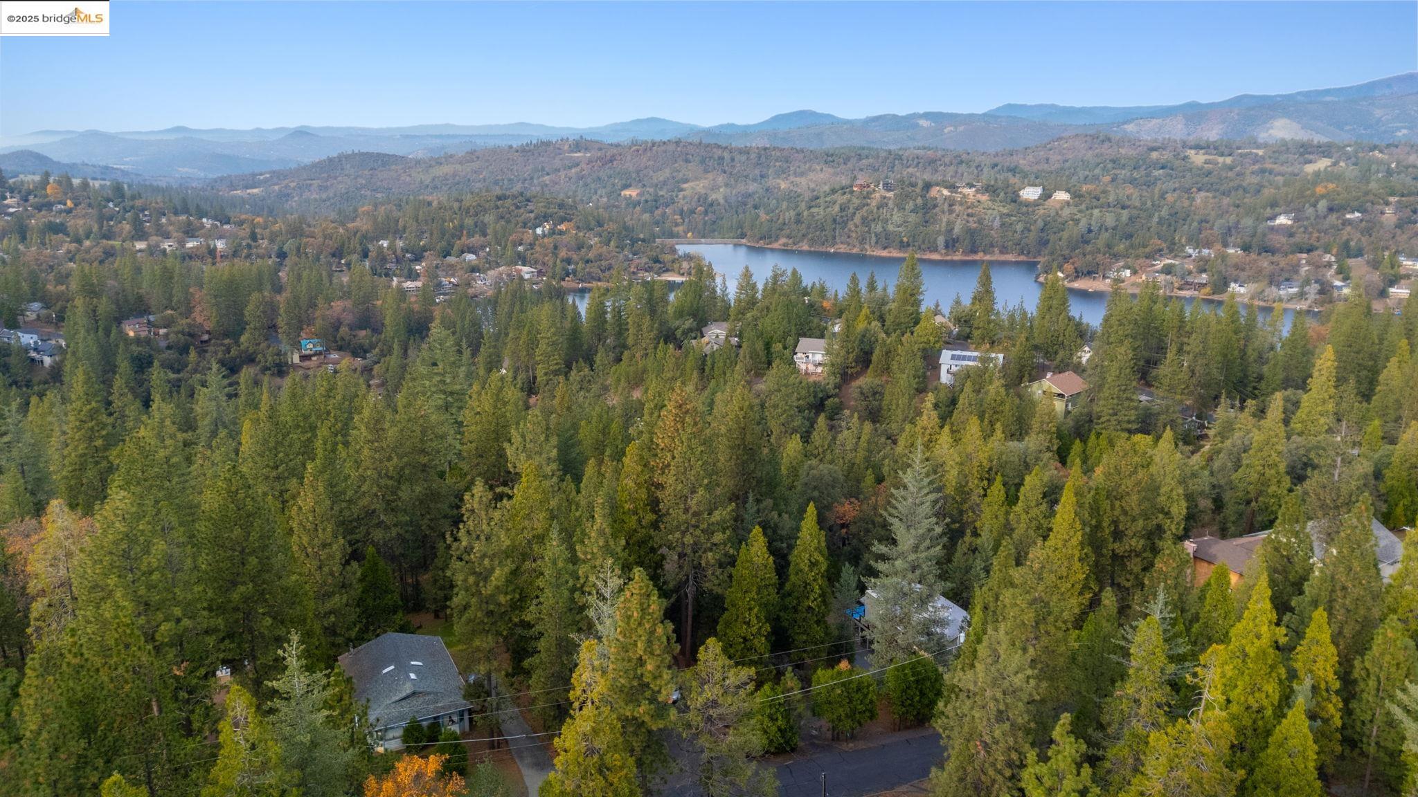 12087 Breckenridge Road Groveland, CA 95321 - Photo 31 of 31 Aerial view of property's location with a forest and a water and mountain view