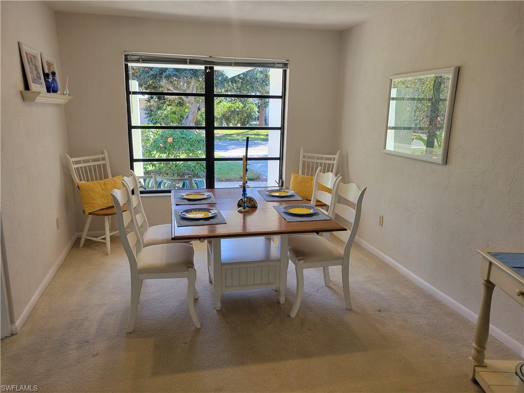 735 High Pines Drive Naples, FL 34103 - Photo 8 of 30 Dining area with carpet flooring