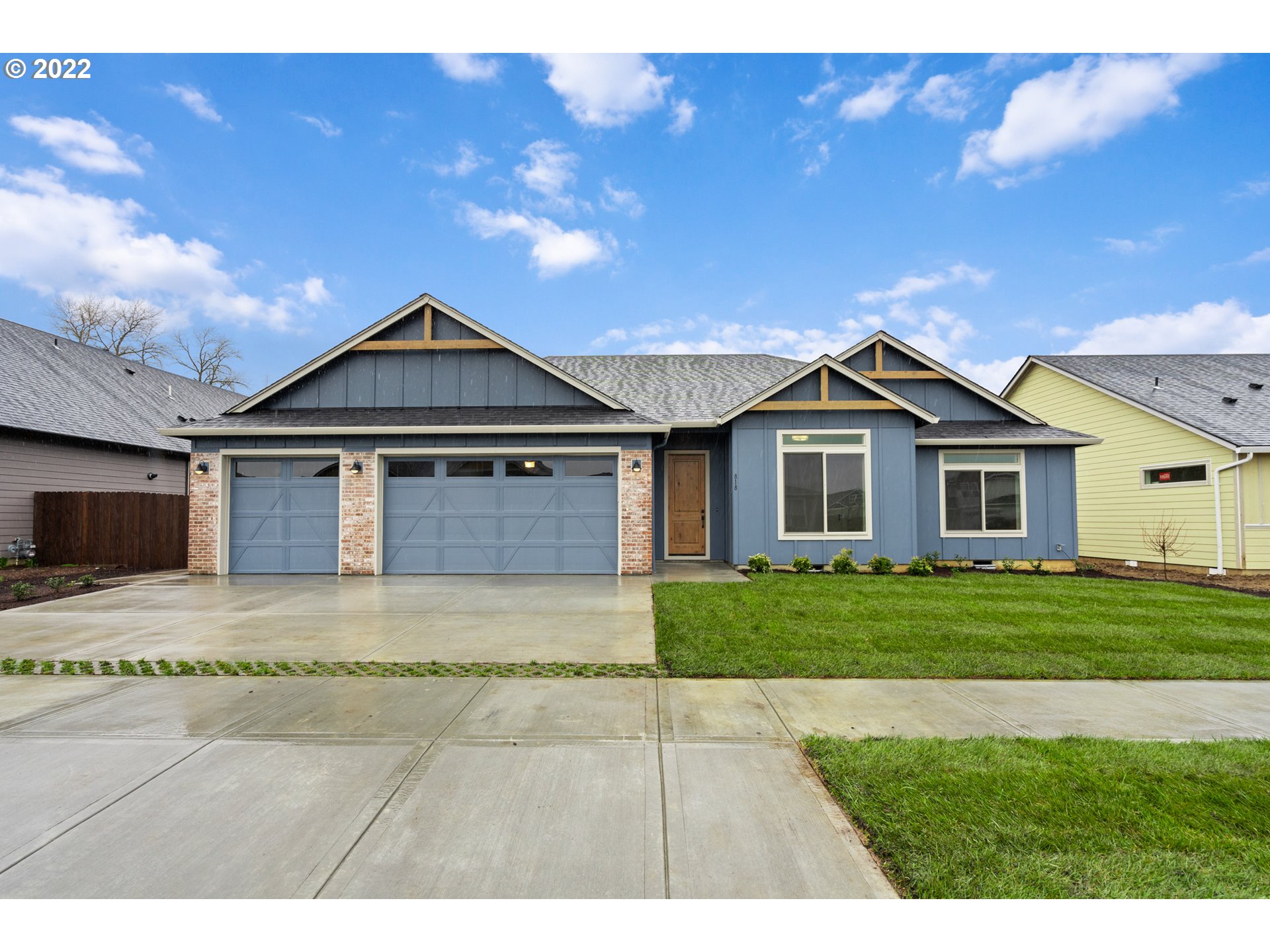 818 South 88th Avenue Ridgefield, WA 98642 - Photo 1 of 32 a front view of a house with a yard