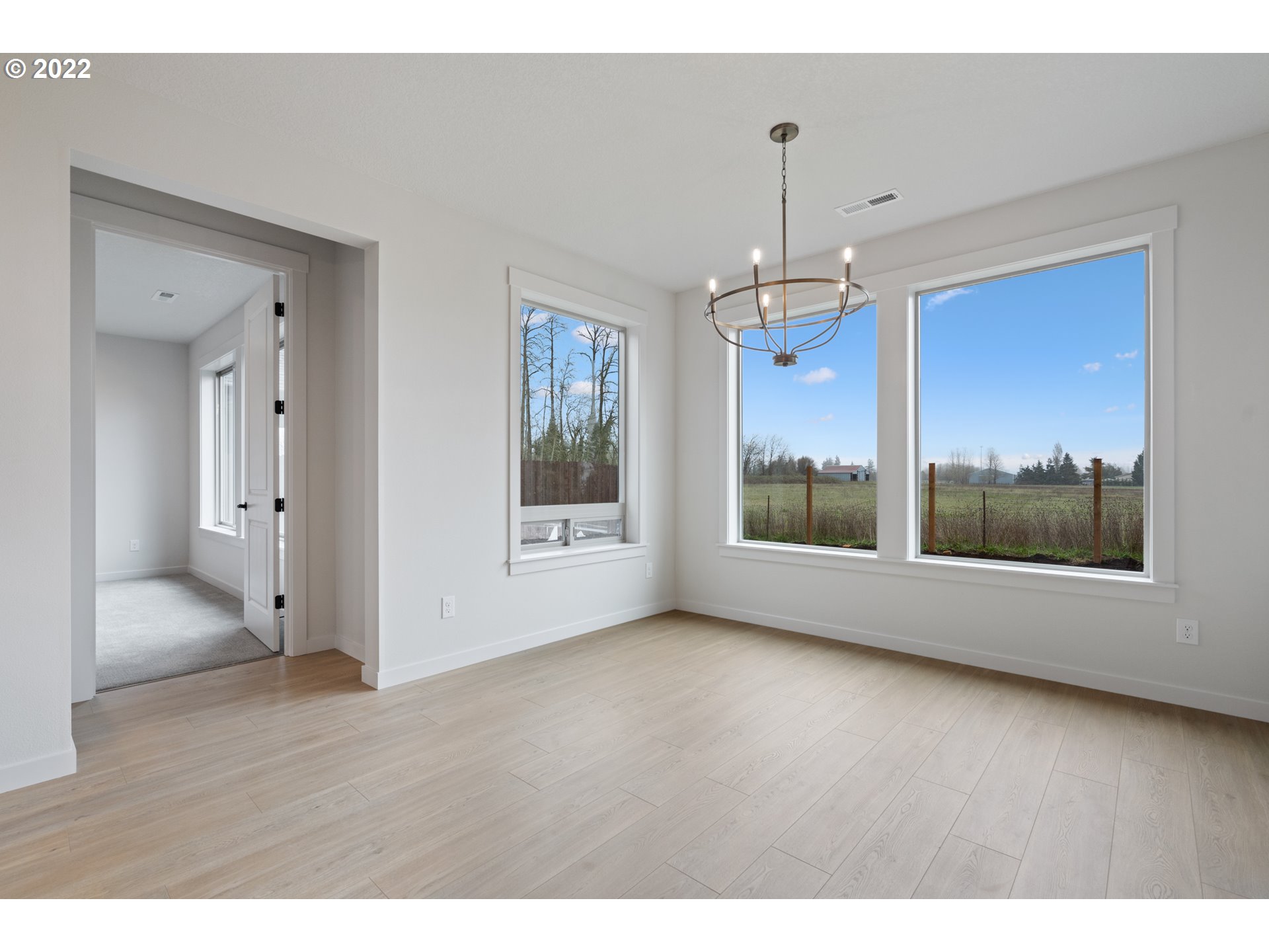 818 South 88th Avenue Ridgefield, WA 98642 - Photo 18 of 32 a view of livingroom with window and hardwood floor