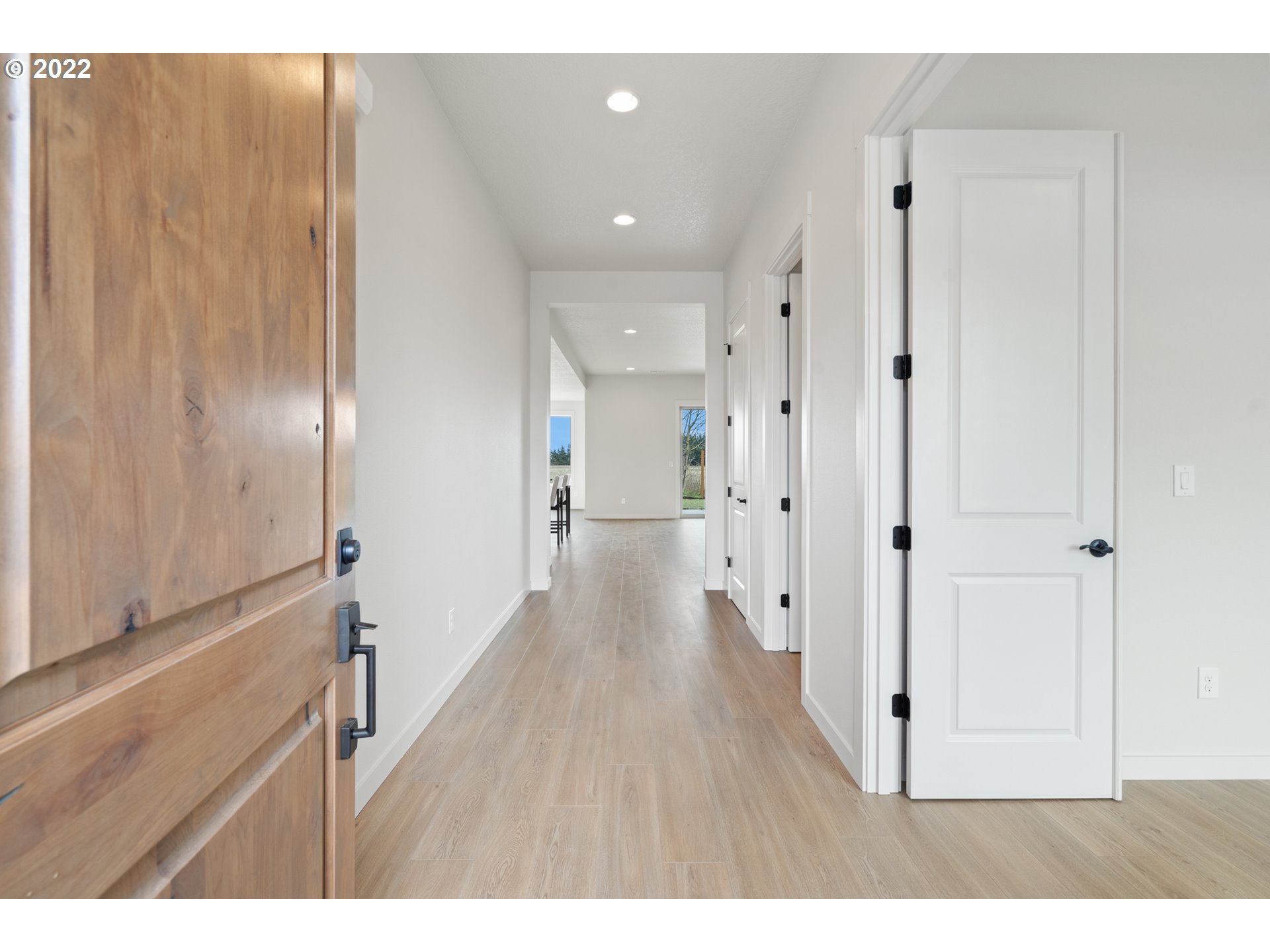818 South 88th Avenue Ridgefield, WA 98642 - Photo 2 of 32 a view of a hallway with wooden floor