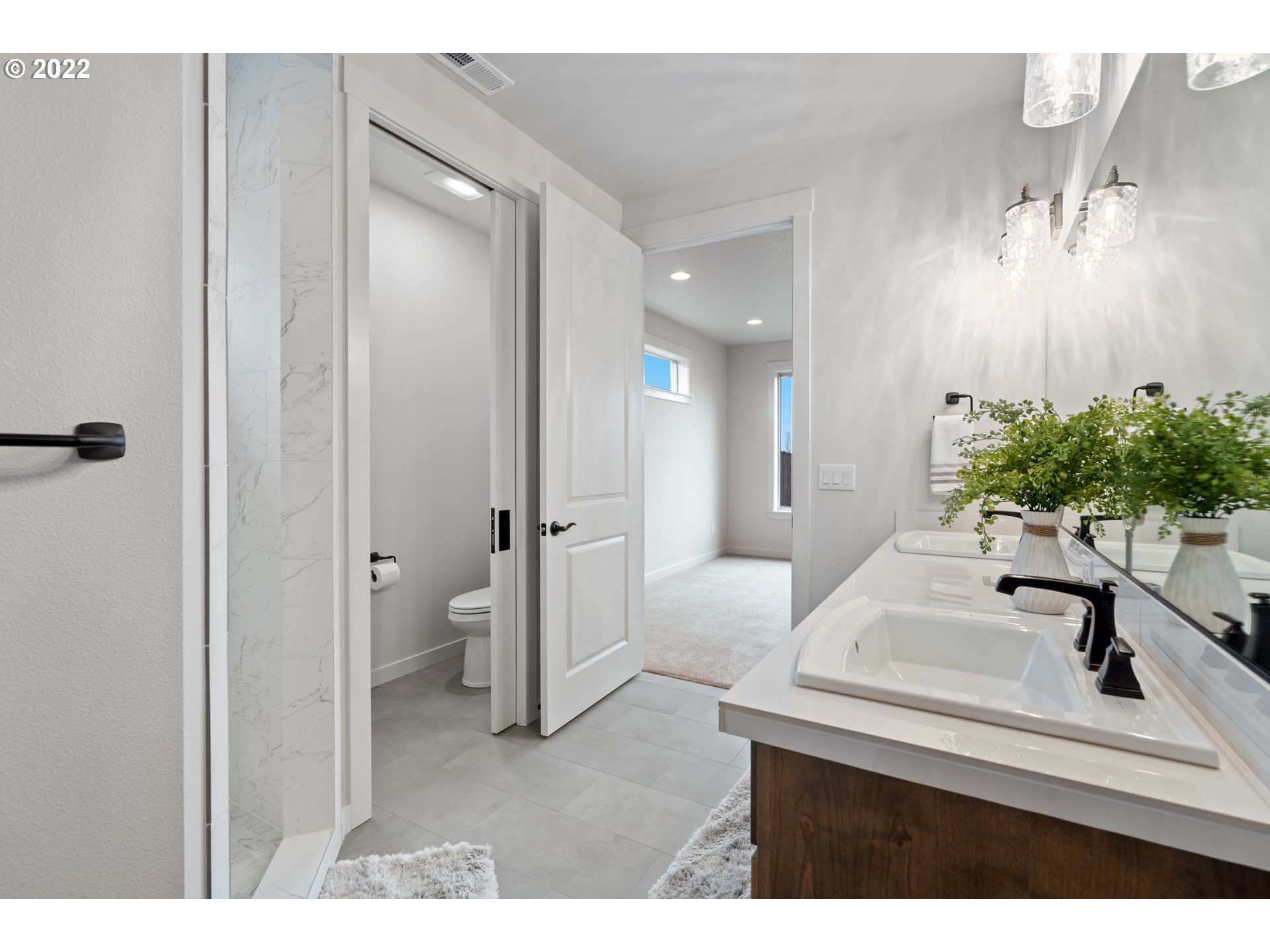 818 South 88th Avenue Ridgefield, WA 98642 - Photo 21 of 32 a bathroom with a sink and a mirror