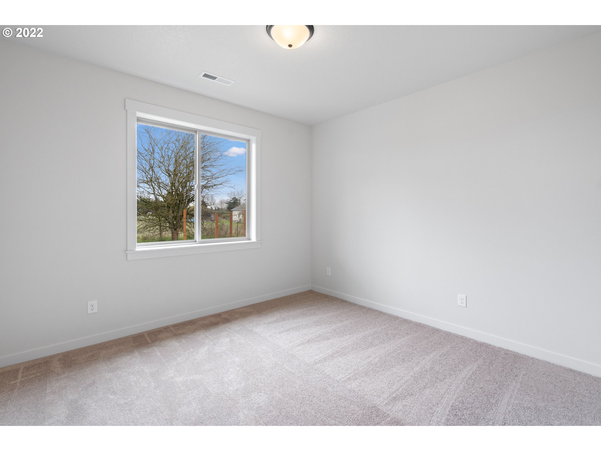 818 South 88th Avenue Ridgefield, WA 98642 - Photo 24 of 32 an empty room with windows