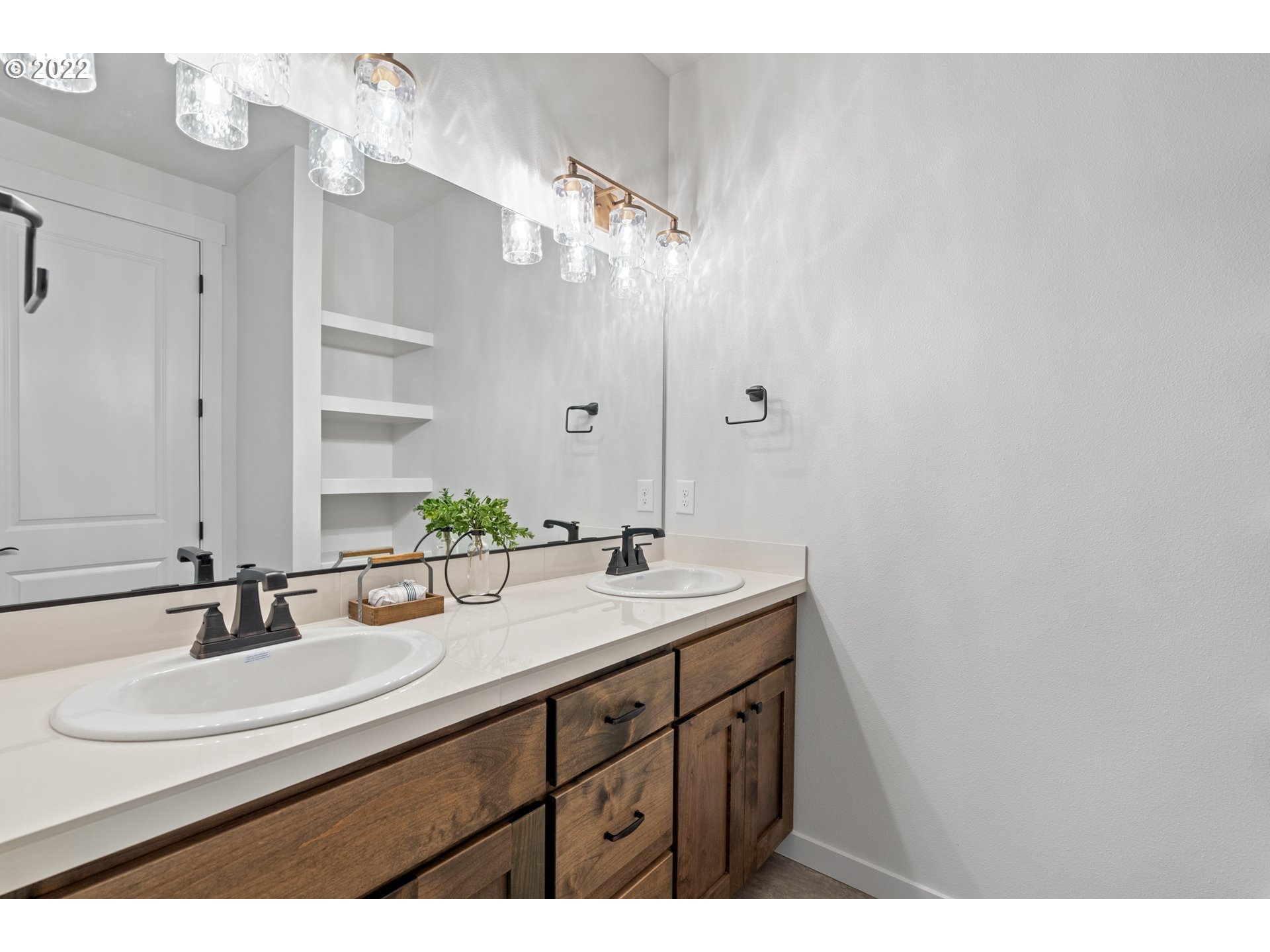 818 South 88th Avenue Ridgefield, WA 98642 - Photo 26 of 32 a bathroom with a sink and a mirror