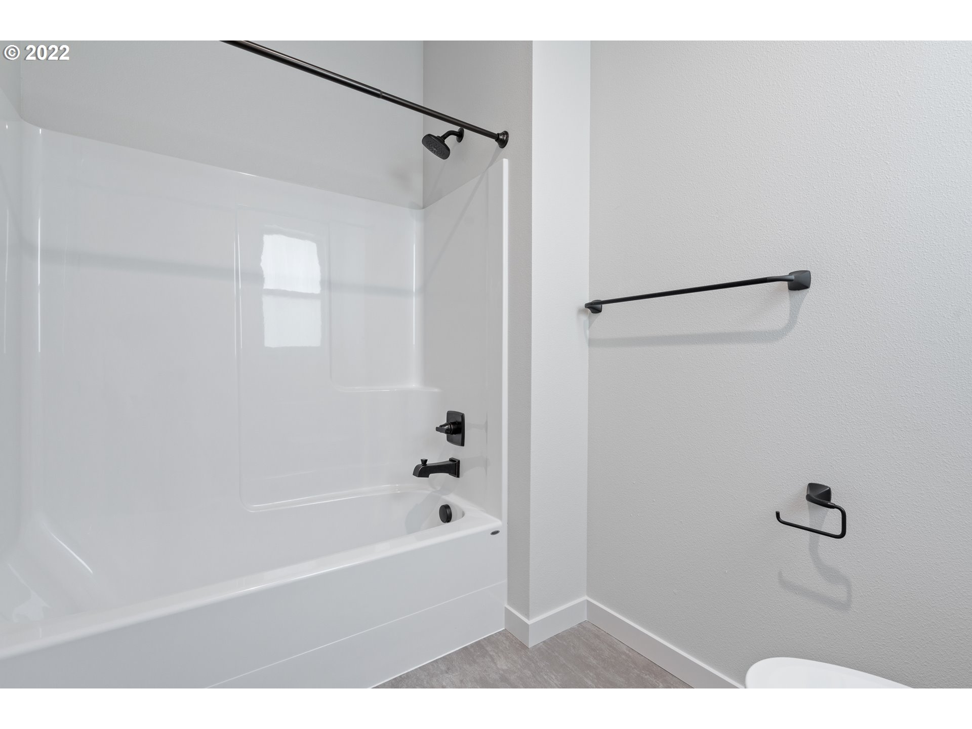 818 South 88th Avenue Ridgefield, WA 98642 - Photo 28 of 32 a bathroom with a bathtub and a shower