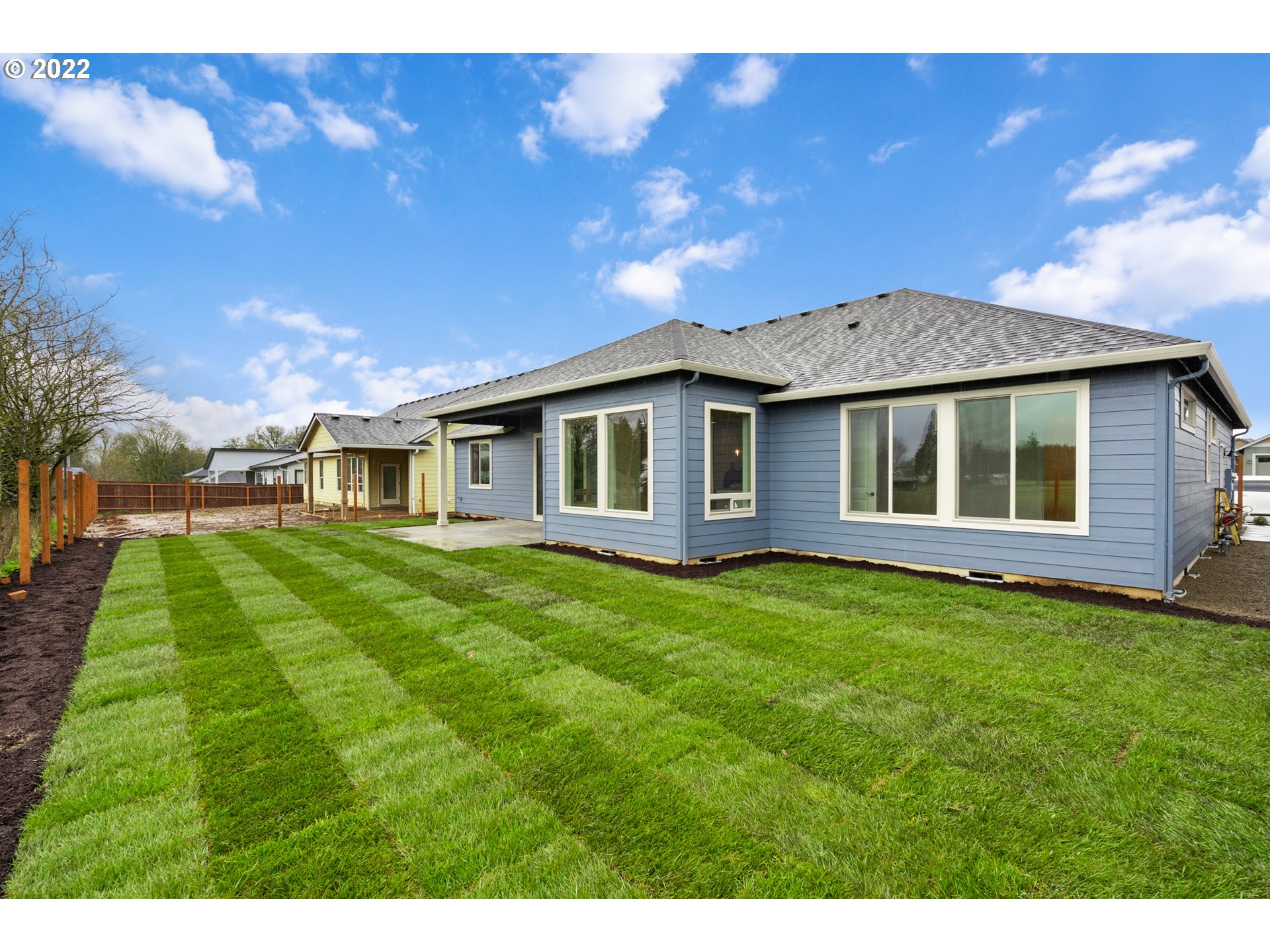 818 South 88th Avenue Ridgefield, WA 98642 - Photo 10 of 32 a front view of a house with a garden