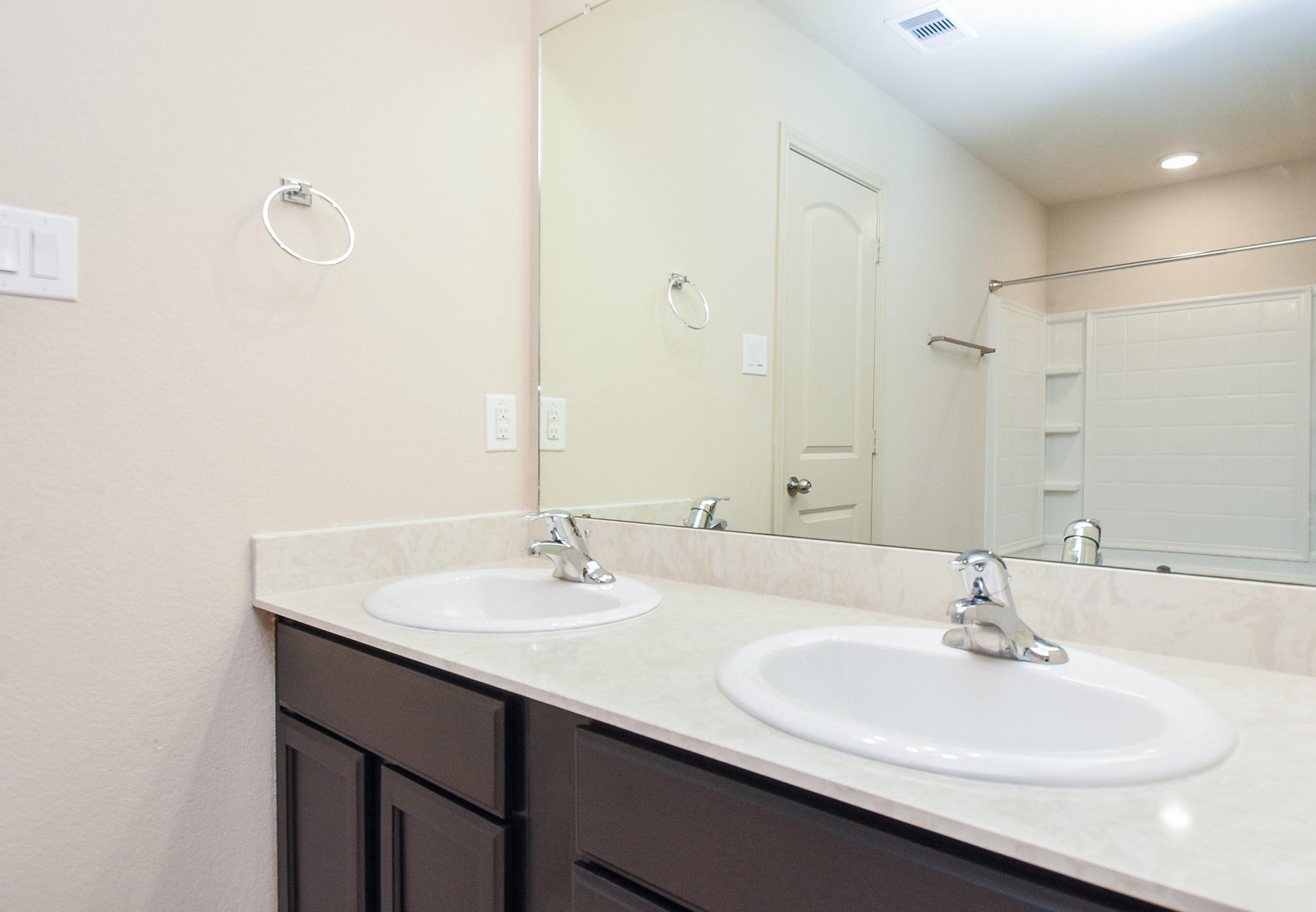 23306 Joyful Way Spring, TX 77373 - Photo 19 of 32 a bathroom with a sink and a mirror
