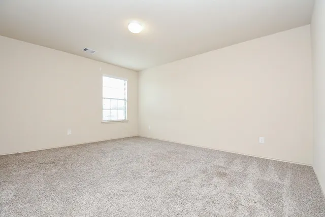an empty room with a natural light