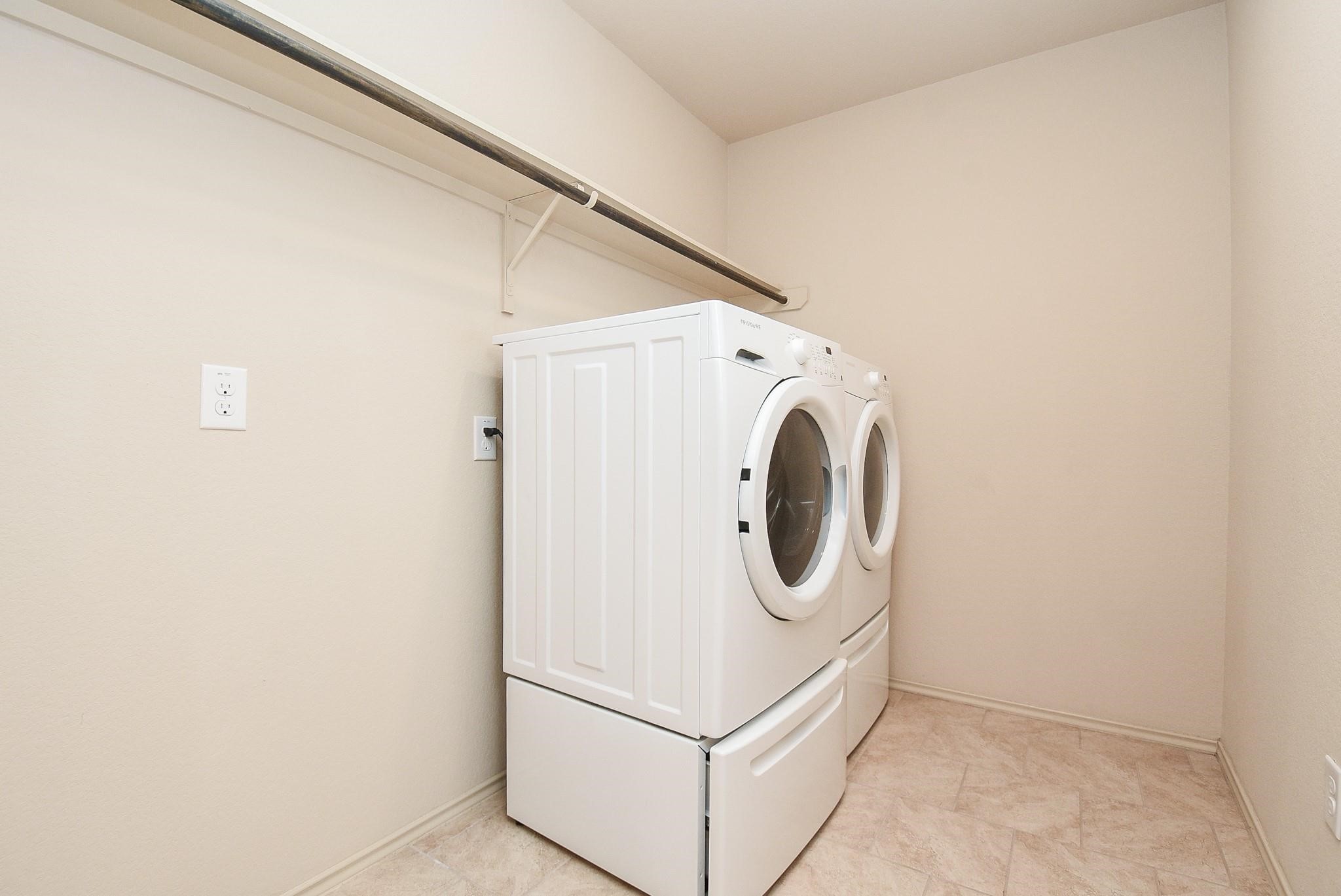 23306 Joyful Way Spring, TX 77373 - Photo 29 of 32 a utility room with dryer and washer