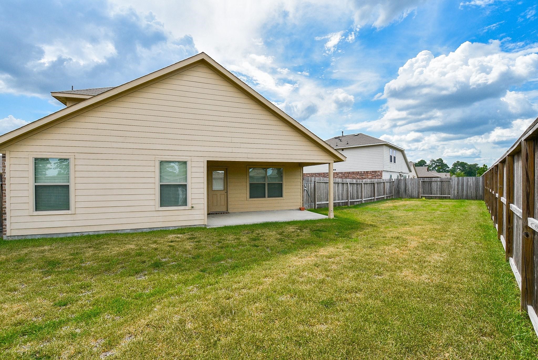 23306 Joyful Way Spring, TX 77373 - Photo 30 of 32 a view of a house with a backyard
