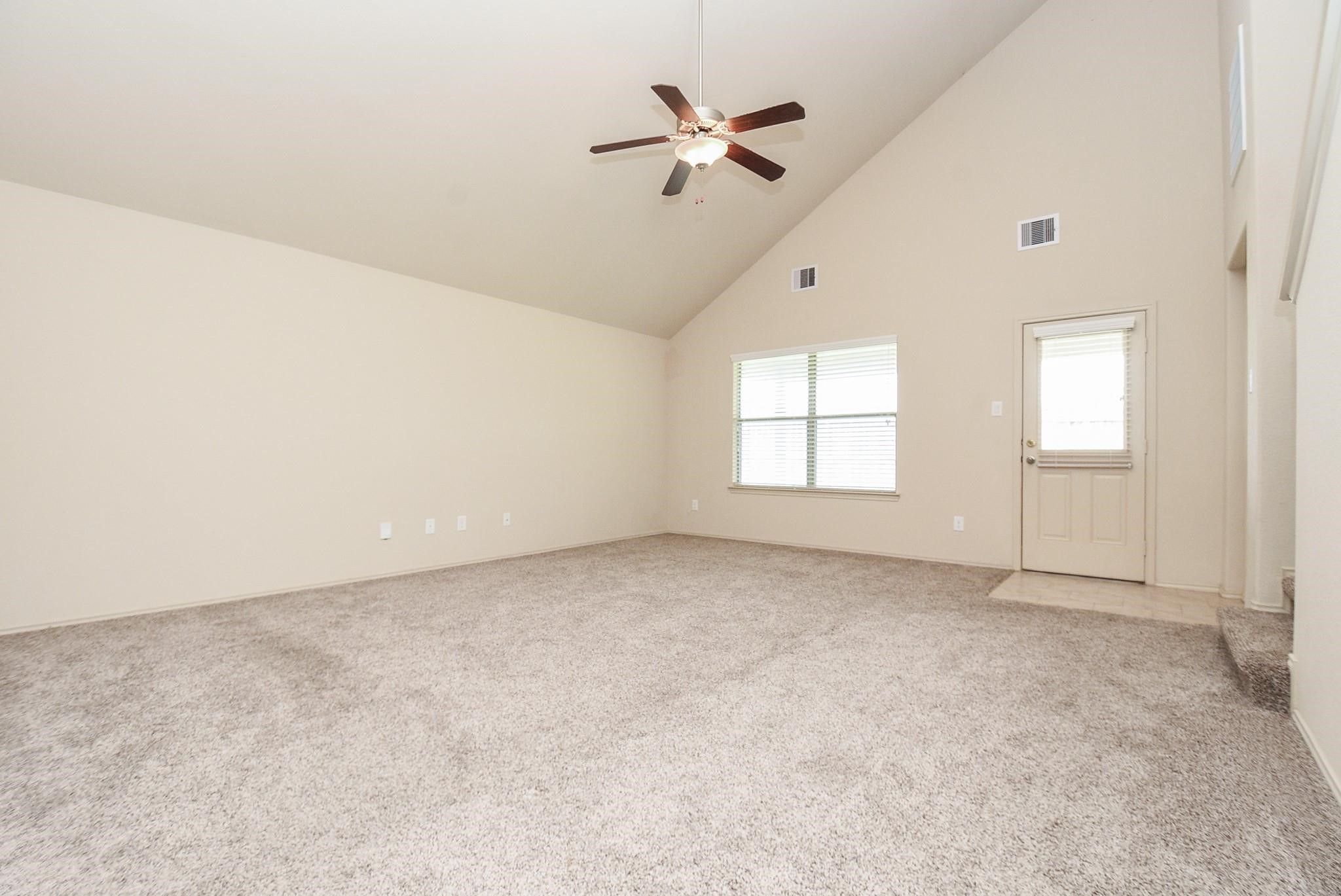 23306 Joyful Way Spring, TX 77373 - Photo 7 of 32 an empty room with fan and windows