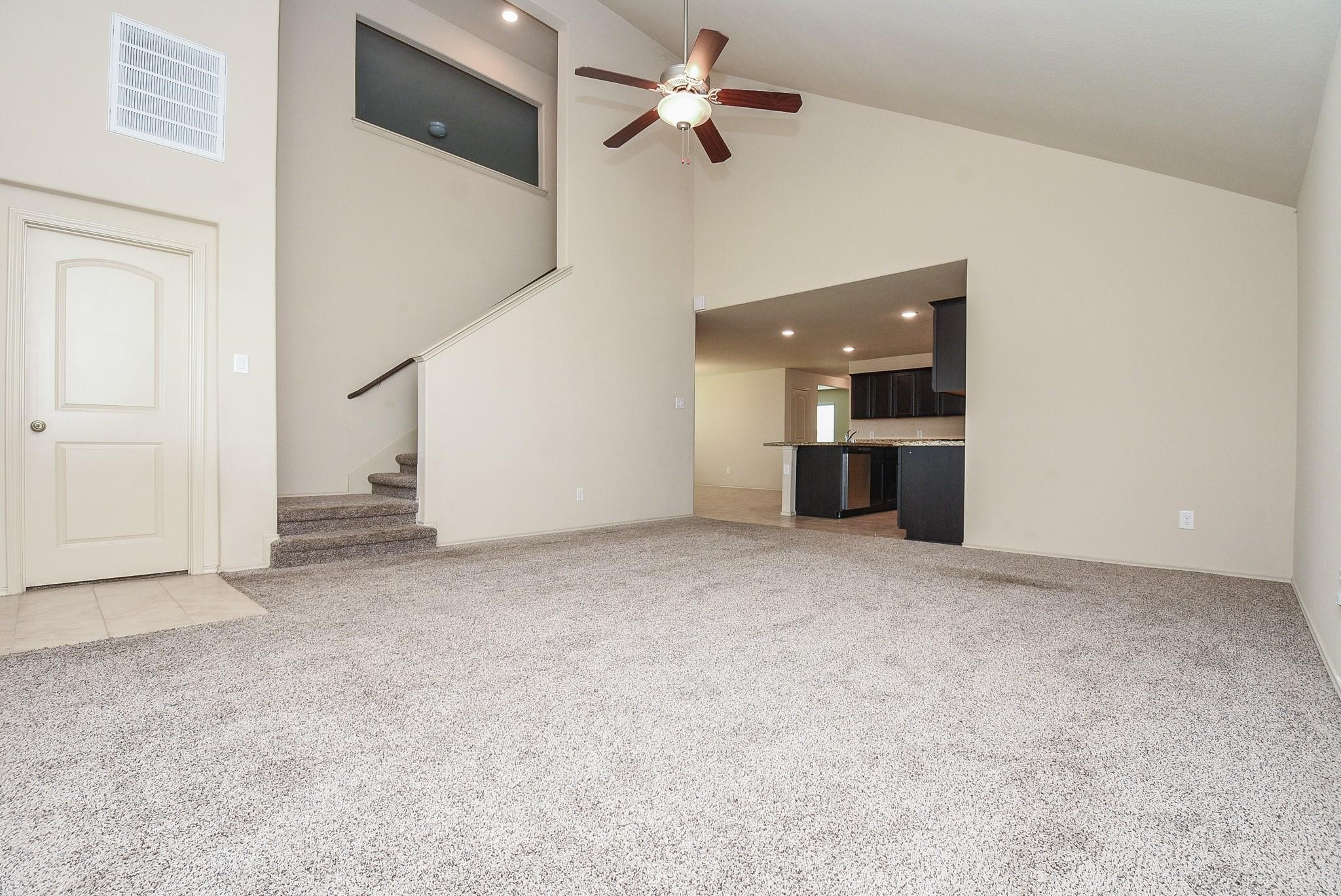 23306 Joyful Way Spring, TX 77373 - Photo 8 of 32 a view of a big room with closet and a ceiling fan