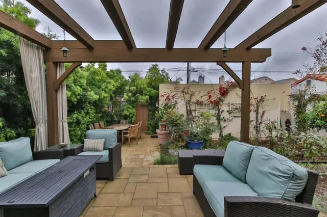 a patio with patio couch and wooden floor