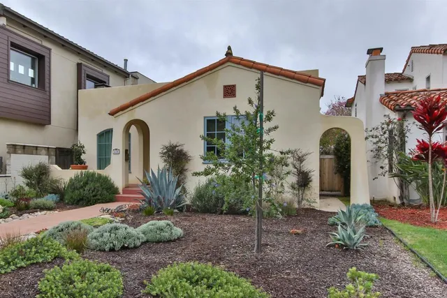 a front view of a house with garden